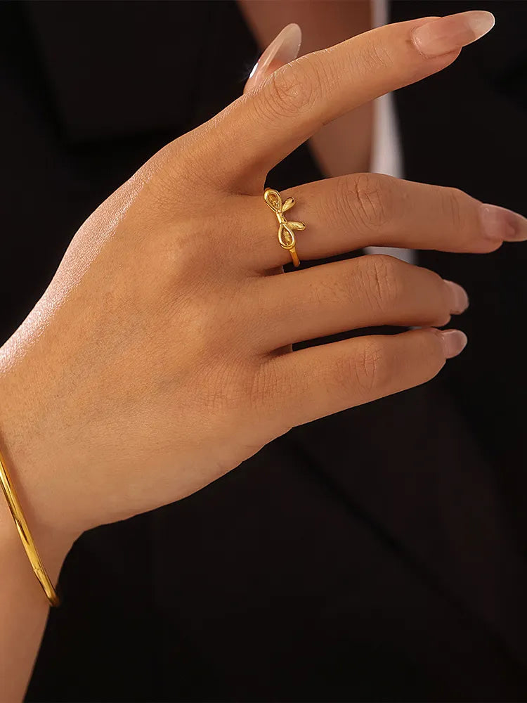 Dainty bow ring worn on finger - view 2