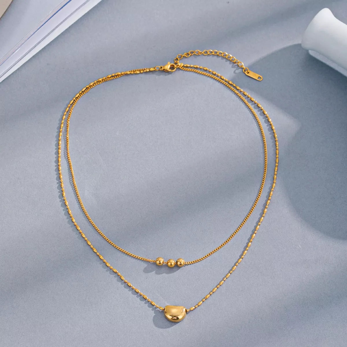 Double layered gold necklace close-up - view 4