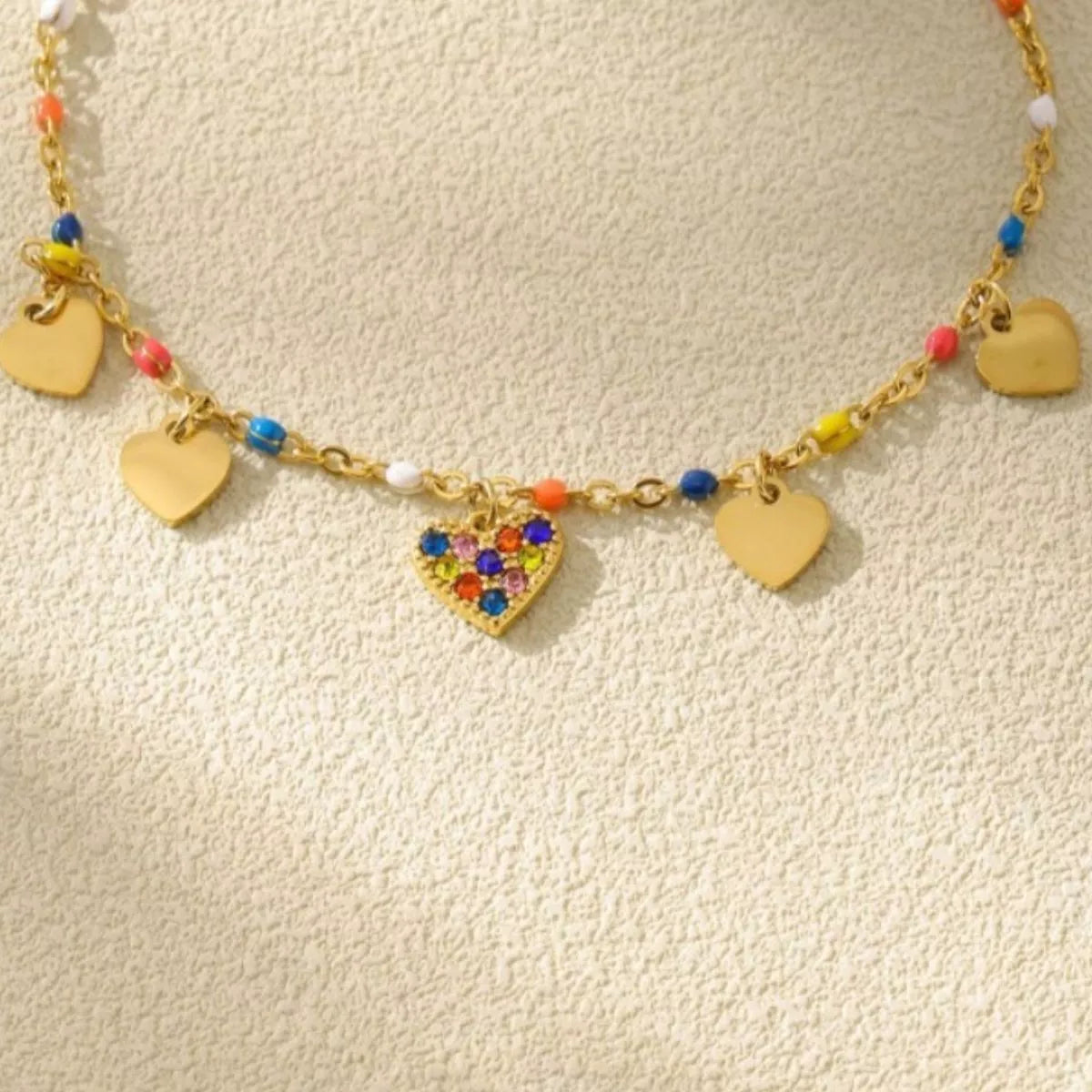 Gold heart charm necklace close-up - view 4