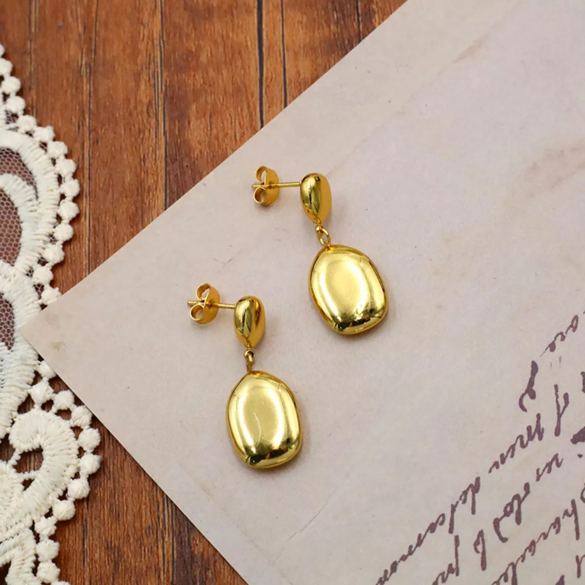 Gold drop earrings close-up - view 4