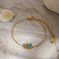 Gold butterfly bracelet with zircon, adjustable - Calypso Blue