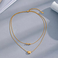 Double layered gold necklace close-up - view 4